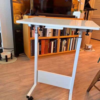 This white JOY worker mobile standing desk features pneumatic height adjustment and lockable wheels 1