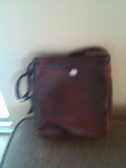 Fabric sling, brown leather bag 3
