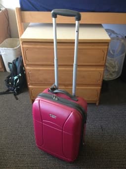 Dark pink Delsey carry-on luggage 1