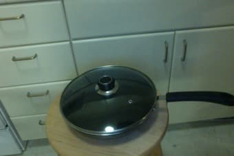 2 large pans, one with glass lid. each $5 2
