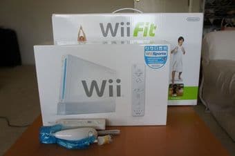 Wii + Wii Fit + Extra controller/nunchuck - $180 1