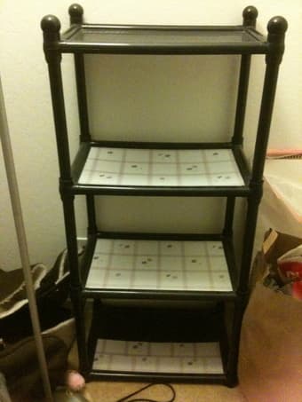 Four tier black plastic shelves - $5 1