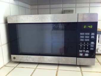 GE Microwave, Vornado Fan, HP All-in-one Printer, HP Monitor 1