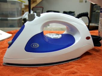 Steam Iron and Full-Size Metal Ironing Board ($20) 1