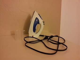 Steam Iron and Full-Size Metal Ironing Board ($20) 3