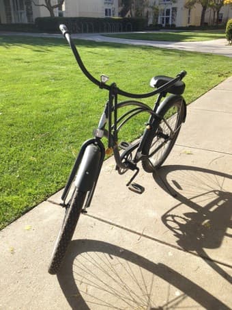 black cruiser bike selling for $100. ~1.5 years old, lock+light incl 2