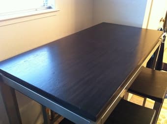 new tall coffee table+4 chairs, short table, bed. old TV 1