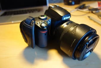 Nikon D40 + 18-70mm 3.5-4.5G ED lens (28-105mm), $285 1