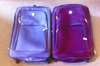 2 large suitcases $10 each ! 1