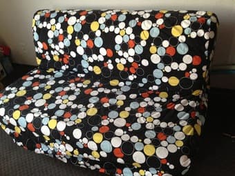 Ikea sofabed with cover and 4 cushions $100 3
