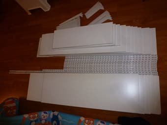 Rubbermaid white wood shelving units (wall mounting). 1