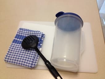 Unused Water Pitcher, Chopping Board and dish cloth 1