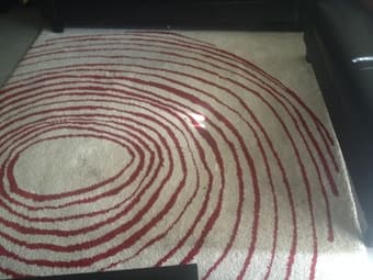 Cream rug with red swirls 1