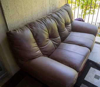 Brown Leather Couch - $100 obo 1