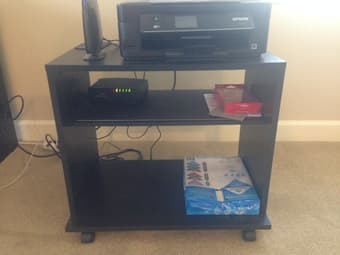 TV rack on wheels (serves as printer rack as well) 7 $ 1