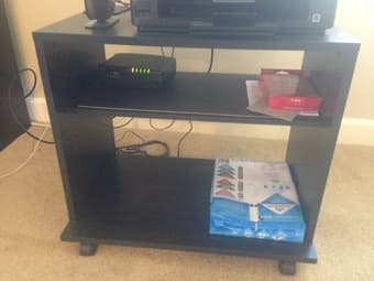 TV rack on wheels (serves as printer rack as well) 7 $ 2
