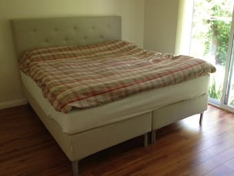 king bed, leaning shelves, two sofas, TV, modems 1