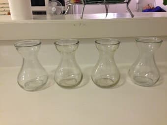 4 matching small vases 1