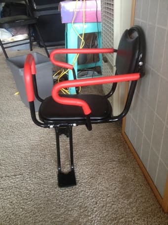 a new bicycle child seat and a female helmet 3