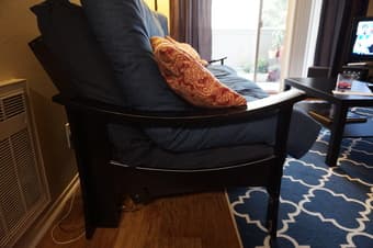Black wooden futon with mattresses and covers $125 1