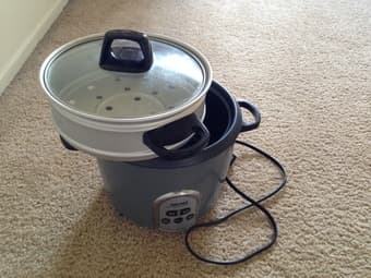 A rice cooker with steam rack - $10 2