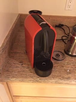 FOR SALE: Nespresso coffee machine, a milk foamer and assorted capsules 2