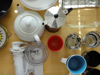 lots of household items: coffee maker, wine opener, can opener... 2