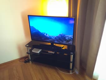 $100 - Corner TV Stand - black glass and stainless steel 1