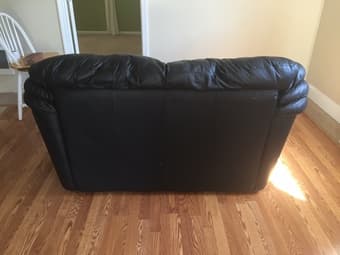 Black leather couch (2 seater) $200 2
