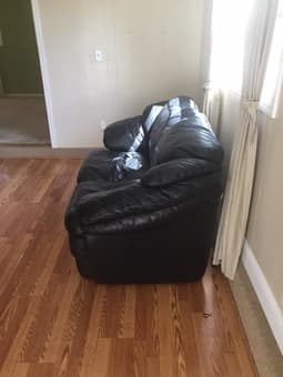 Black leather couch (2 seater) $200 3