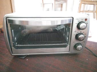 Oster contertop oven, fake plants, IKEA rug, Dirt devil vaccum 1