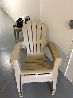 Plastic armchairs and little tables 1