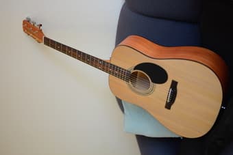 $65 new guitar, $15 guitar case 1