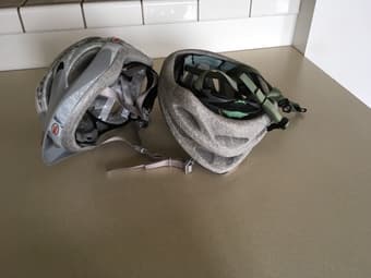 2 bike helmets for sale - $10 each - light green and grey 2