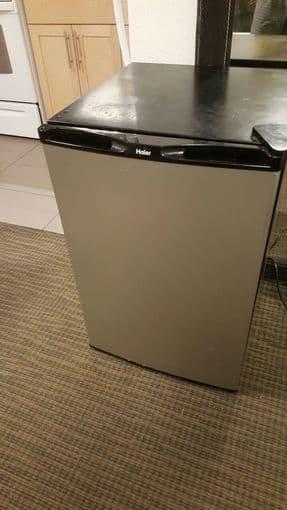 A Haier mini fridge $50 moving sale 2