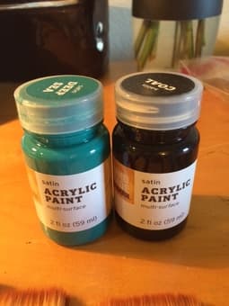 Barely used paintbrushes and acrylic paint (teal and black) 1