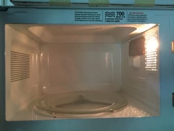 White 700 watt Microwave Oven. 1