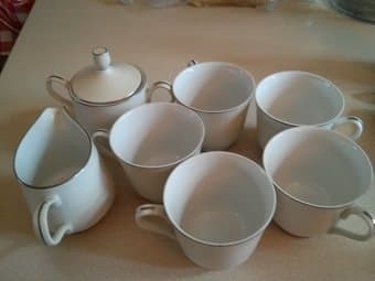 set of tea cups along with milk pitcher and sugar bowl 1