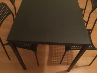 A full wooden tale with four chairs for study and dinning. 2