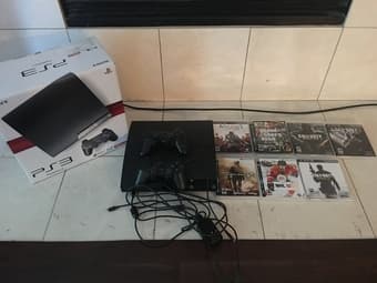playstation 3 with original box+2controllers+7games 1