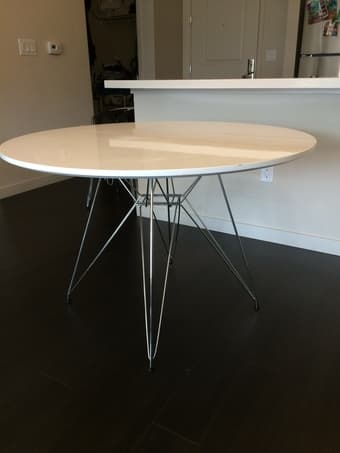 Modern round dinner table, sleak furnace, metal legs 1
