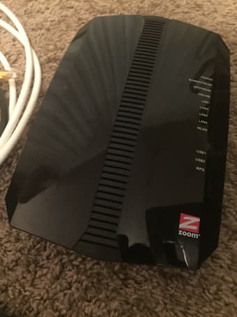 Zoom Cable modem/Router with respective Ethernet cables 1