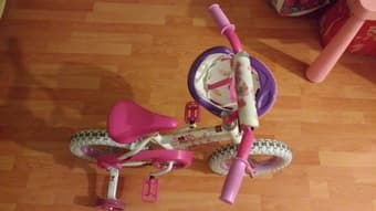 12" pink bike and helmet 1