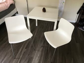 White table and two white chairs from ikea 1