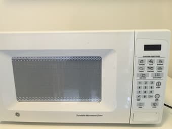 Moving Sale: GE microwave oven-75 1
