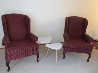 2 love chairs with 2 small tables 1