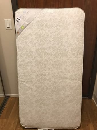 sofa, crib mattress, laundry hamper 1