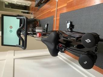 Lightly Used Peloton Bike with 3 lb weights and mat 3