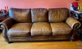 Handsome and comfortable leather couch, about 8 years old. Moving sale 1