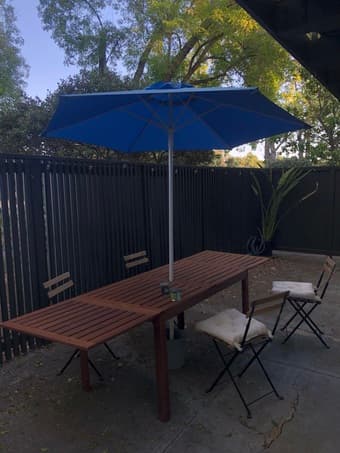 Porch table ($175), 4x wood chairs ($75 total) table umbrella ($30) 2
